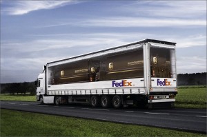 UPS Trucks carried on a FedEx Truck